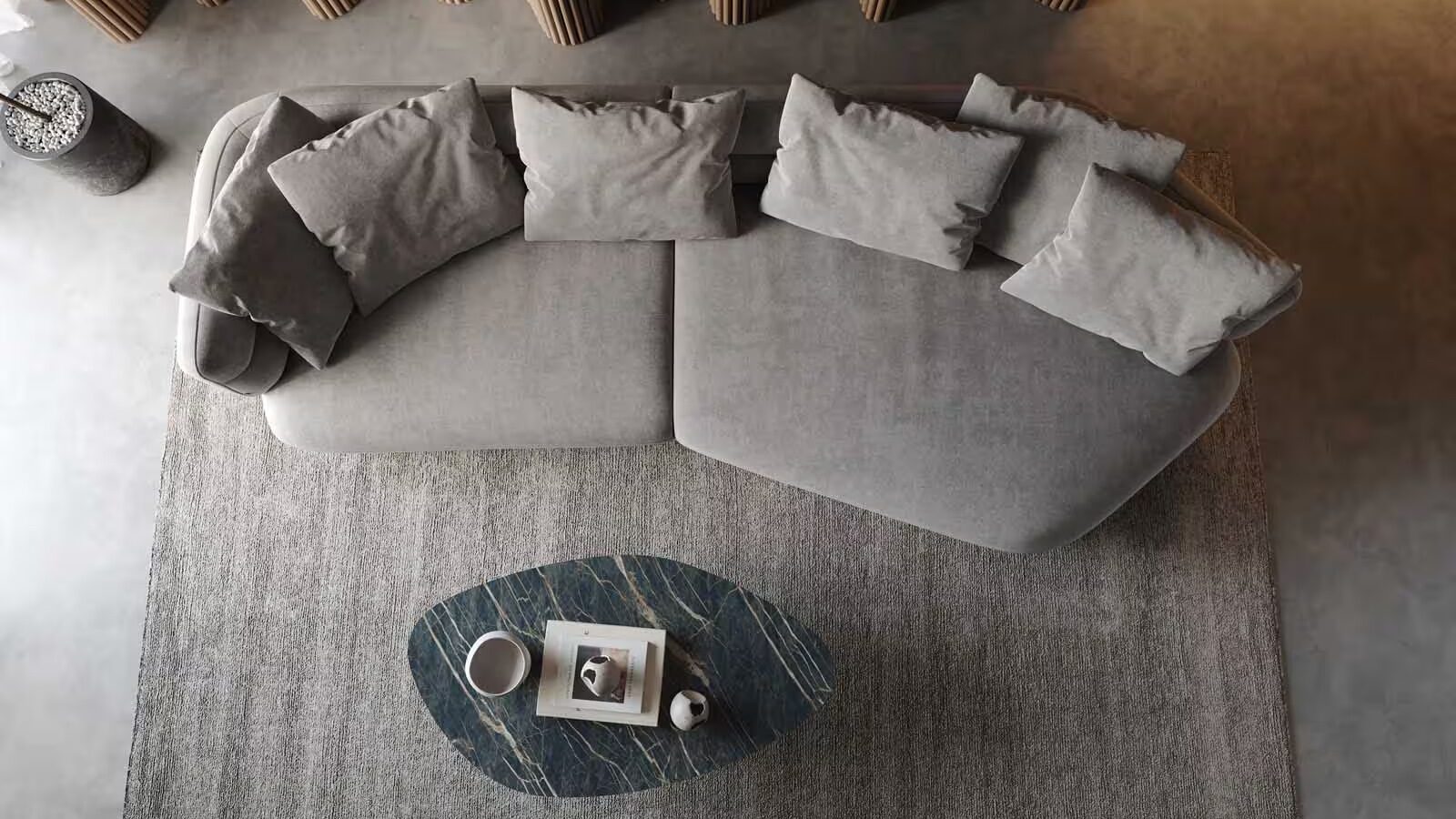 Draufsicht Sofa organische form - das Sofa steht auf einem Teppich mit einem Couchtisch
